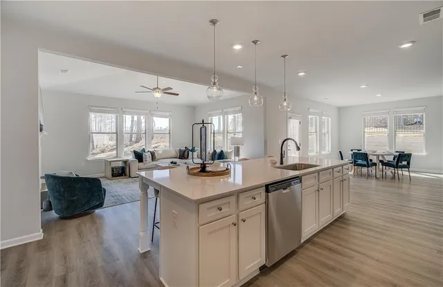 a large kitchen with lots of counter space a sink and appliances