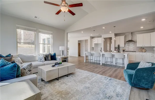 a living room with furniture and a large window