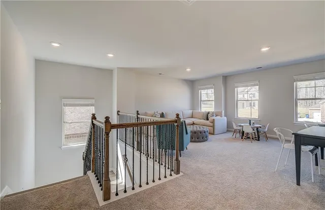 a view of a livingroom with furniture and windows