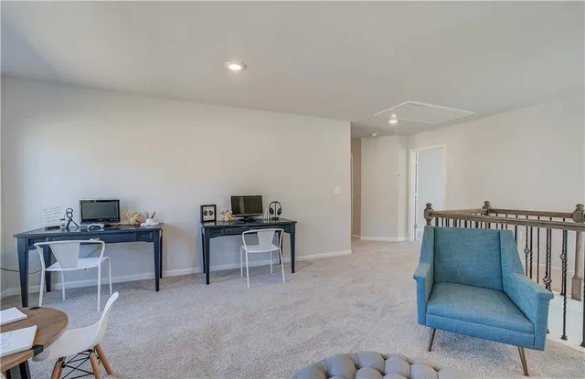 a workspace with furniture and window