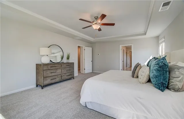 a spacious bathroom with a bathtub sink and mirror