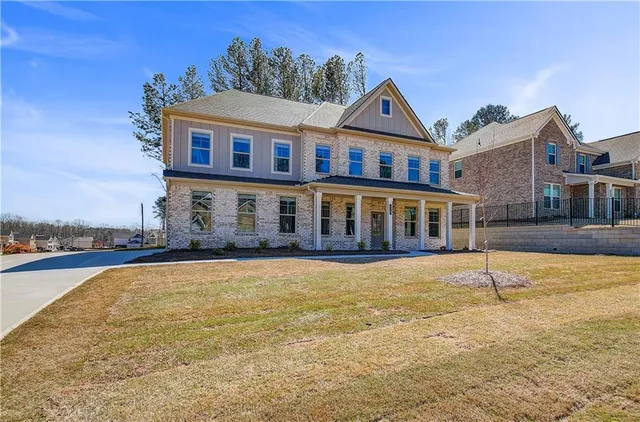 a front view of a house with a yard