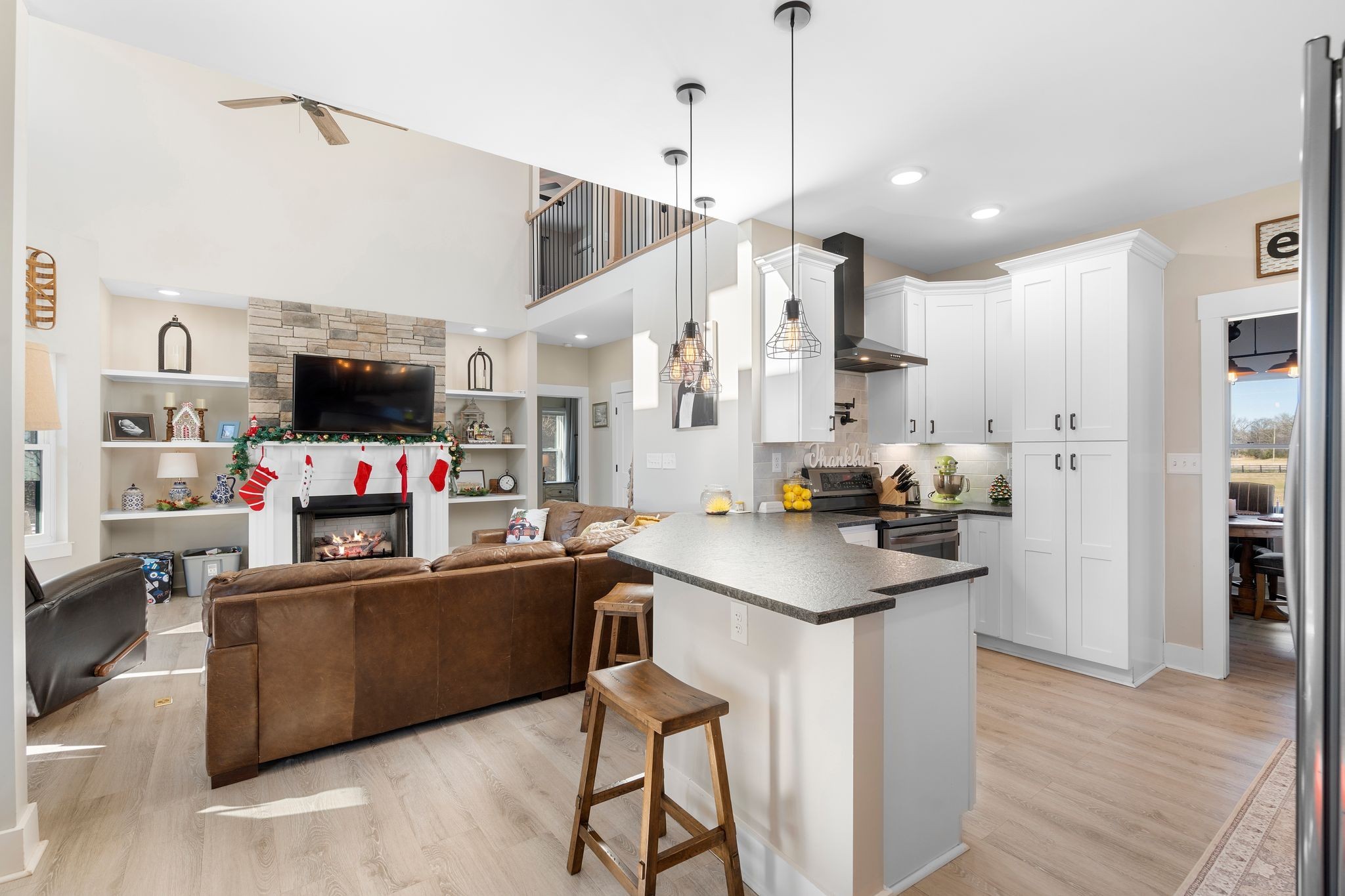 5650 Sledge Road Christiana, TN 37037 - Photo 12 of 50 a kitchen with stainless steel appliances kitchen island granite countertop a sink and a refrigerator