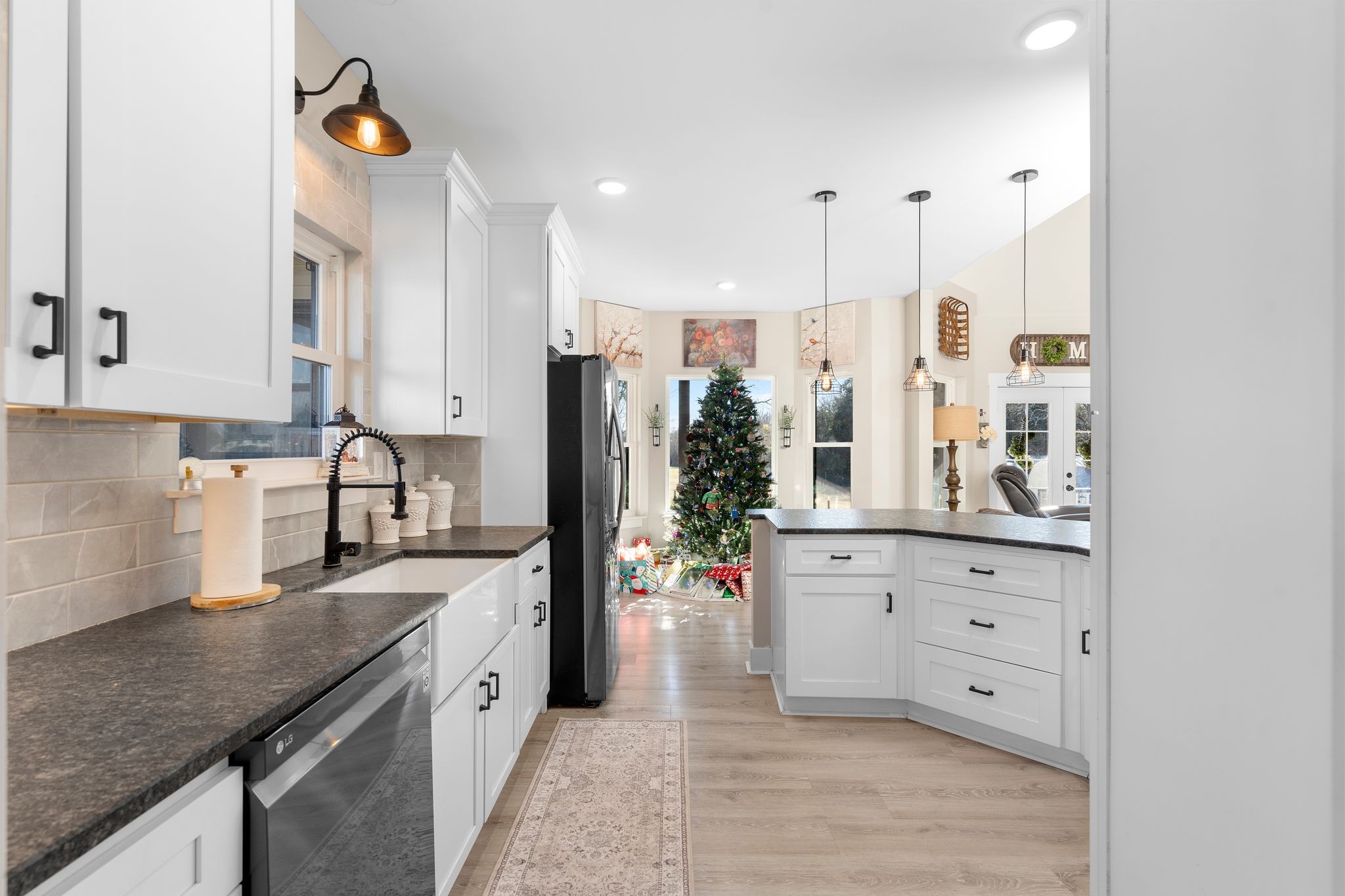 5650 Sledge Road Christiana, TN 37037 - Photo 14 of 50 a kitchen with stainless steel appliances granite countertop a stove a sink and a refrigerator