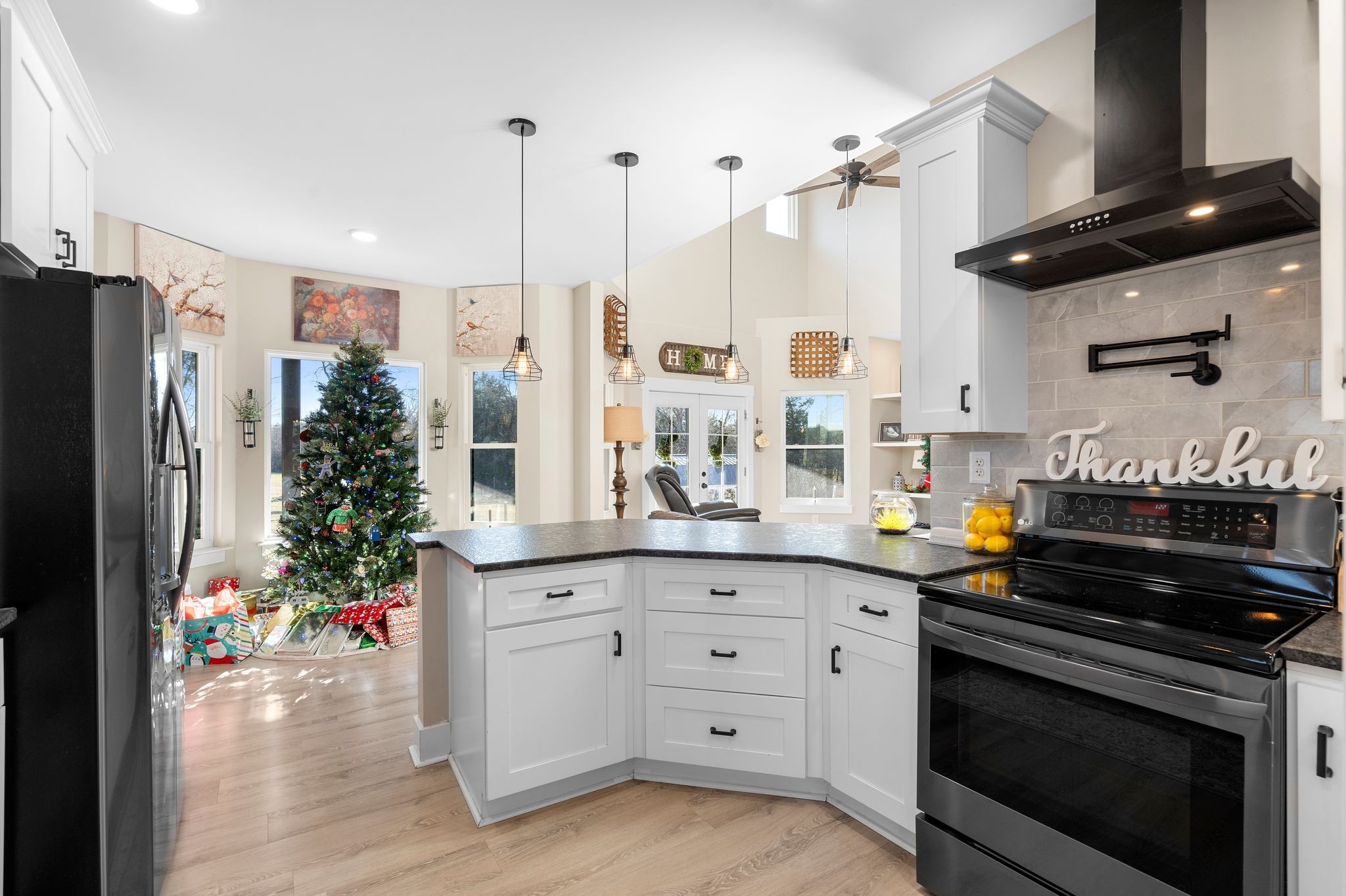5650 Sledge Road Christiana, TN 37037 - Photo 16 of 50 a kitchen with stainless steel appliances a stove a refrigerator and a sink