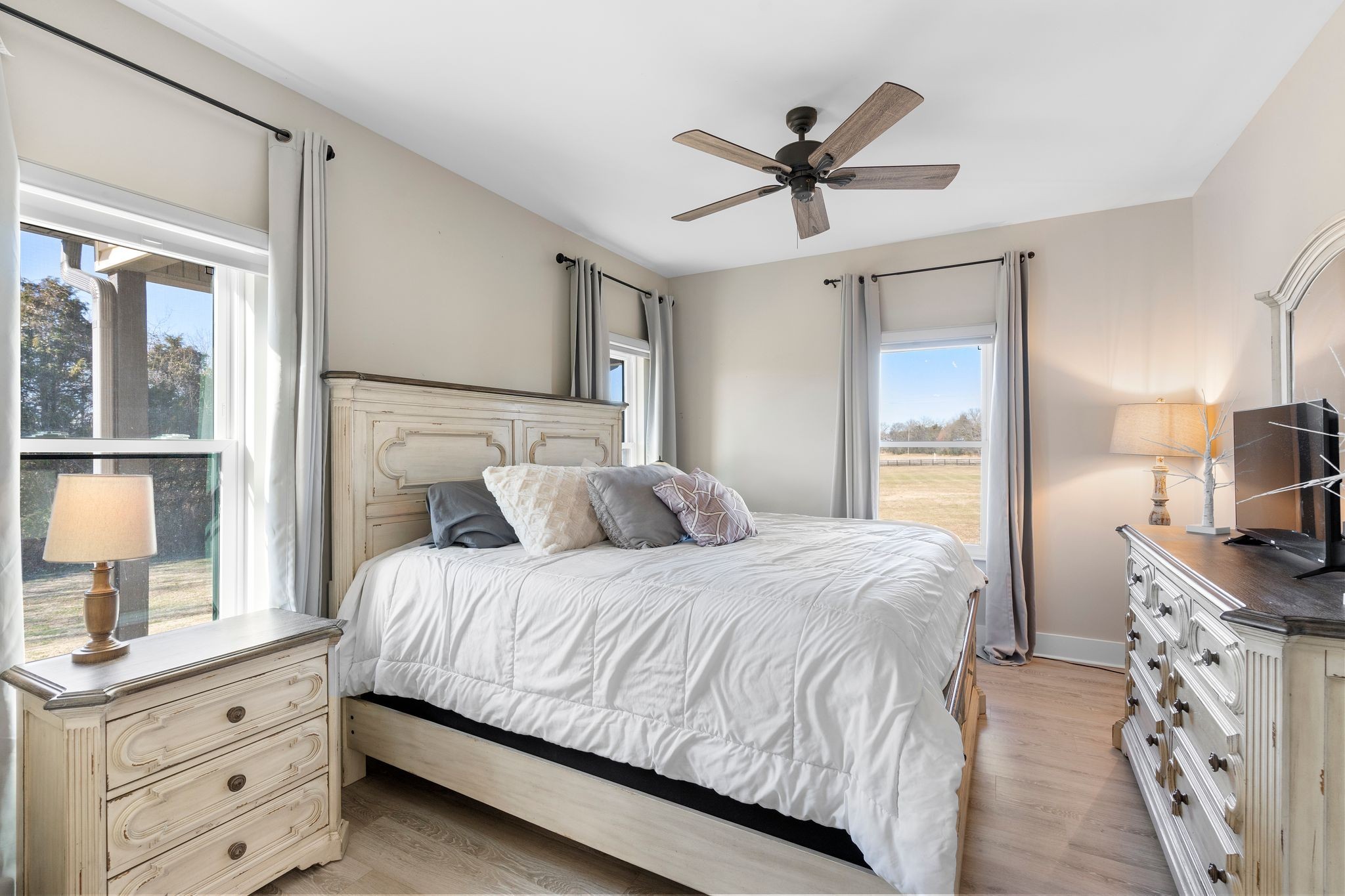 5650 Sledge Road Christiana, TN 37037 - Photo 21 of 50 a bedroom with a bed and a chandelier