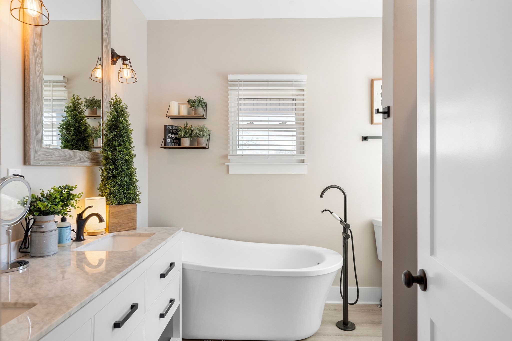 5650 Sledge Road Christiana, TN 37037 - Photo 24 of 50 a bathroom with a granite countertop sink a mirror and bathtub