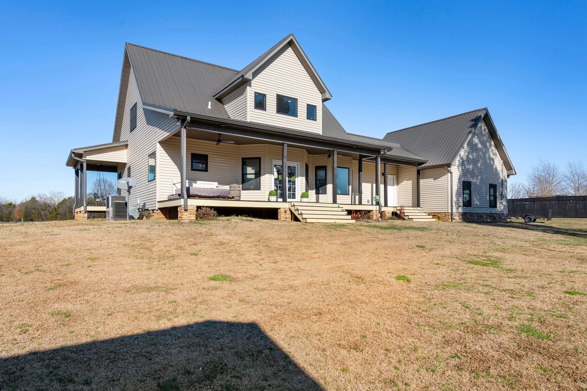 5650 Sledge Road Christiana, TN 37037 - Photo 33 of 50 a front view of a house with a yard and trees