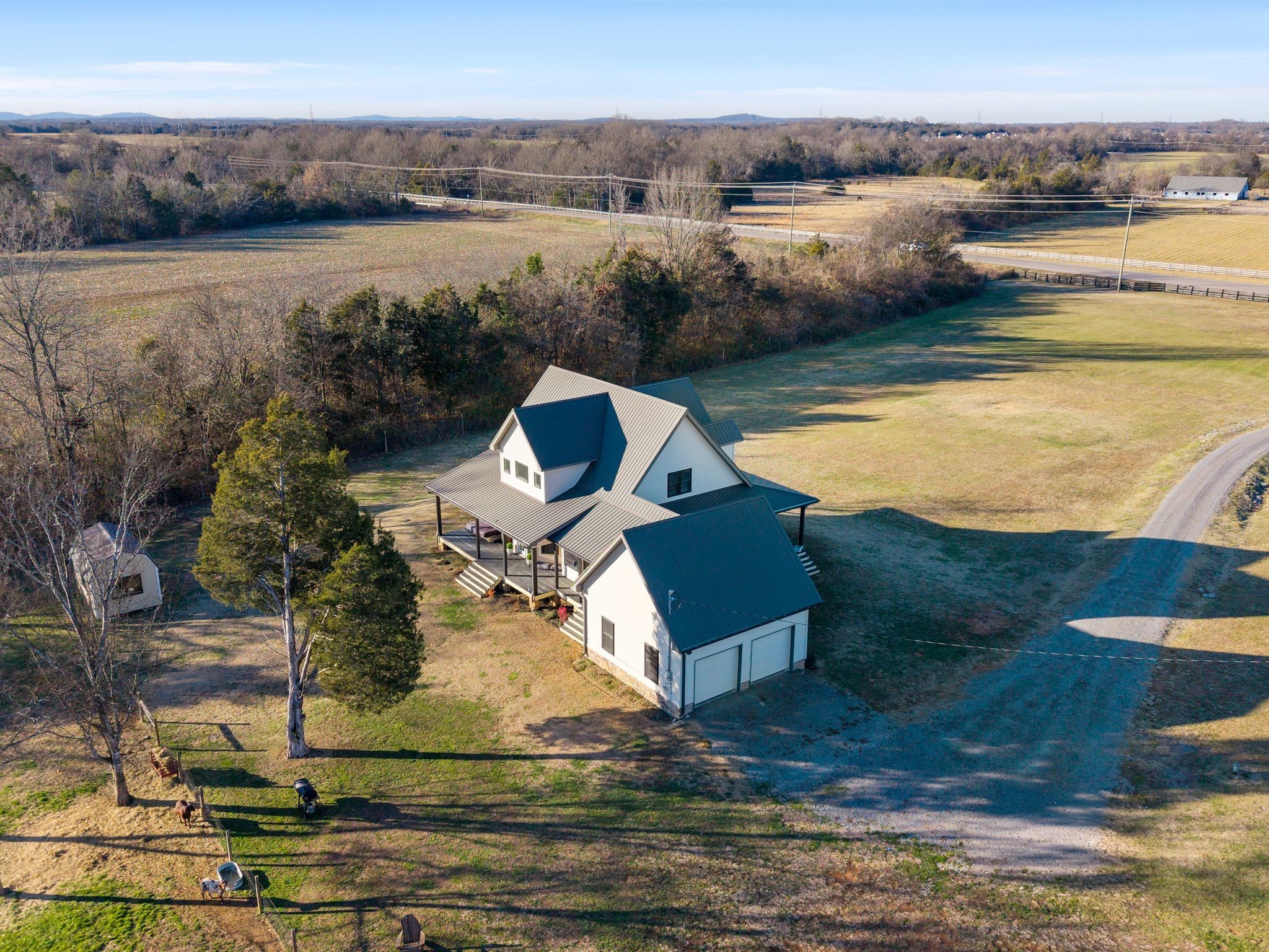 5650 Sledge Road Christiana, TN 37037 - Photo 46 of 50 a view of a lake with a yard and mountain view