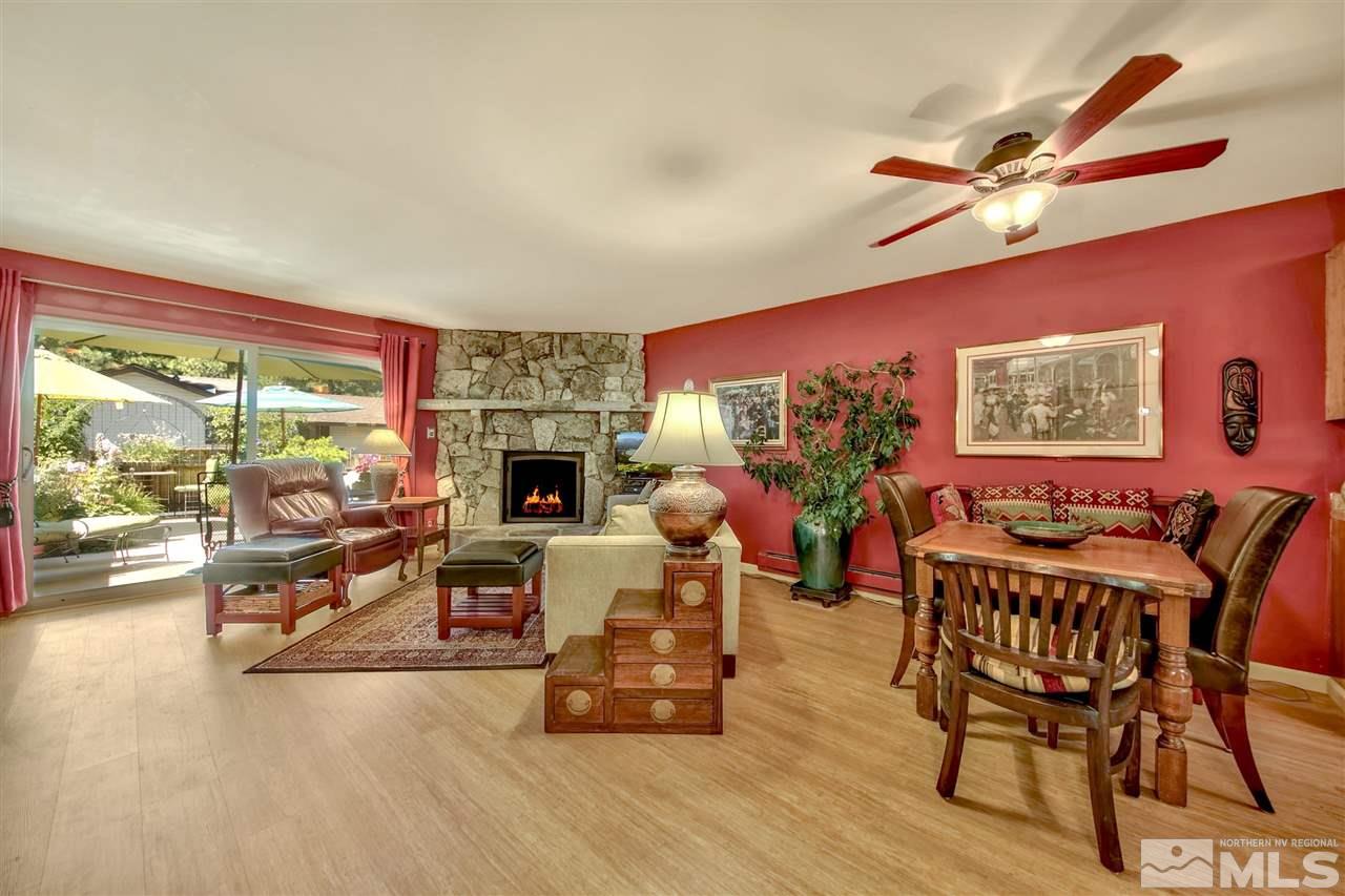 450 Mcfaul Way Zephyr Cove, NV 89448 - Photo 1 of 20 a living room with furniture a fireplace and a large window