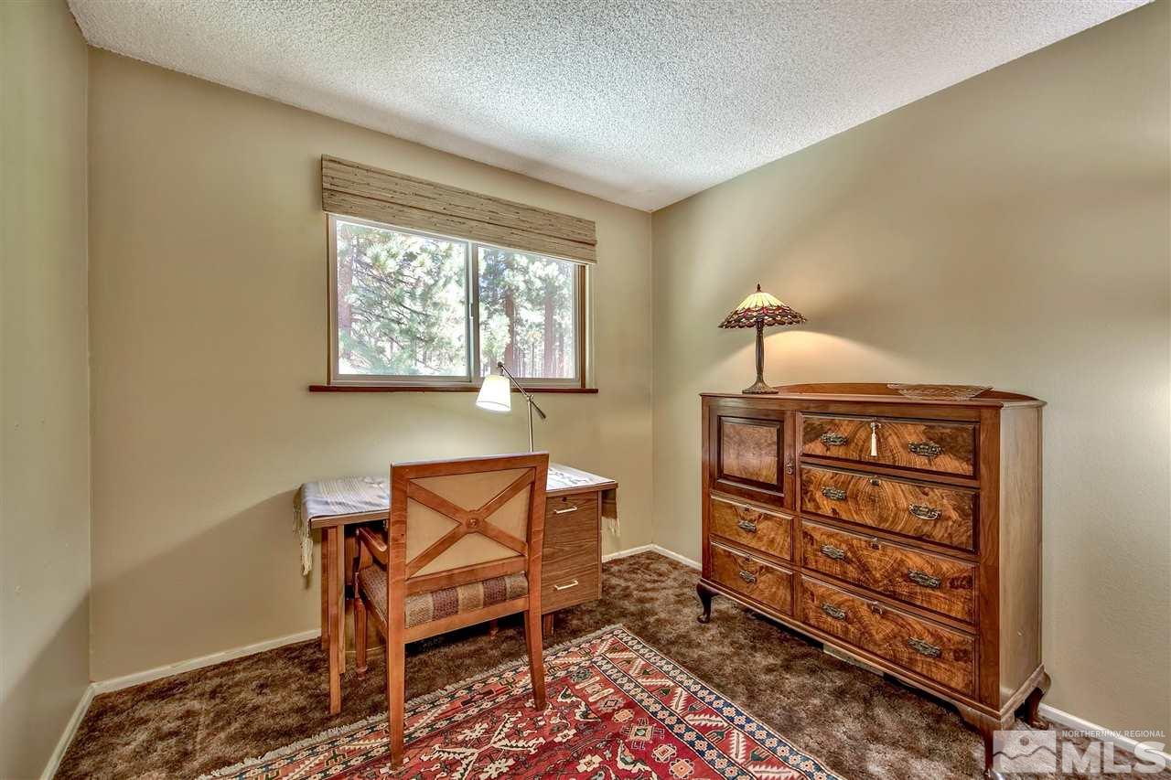 450 Mcfaul Way Zephyr Cove, NV 89448 - Photo 12 of 20 a living room with furniture a piano and a window