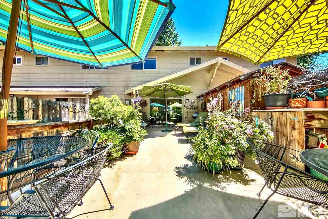 450 Mcfaul Way Zephyr Cove, NV 89448 - Photo 15 of 20 a yellow and red umbrella sitting in front of a house