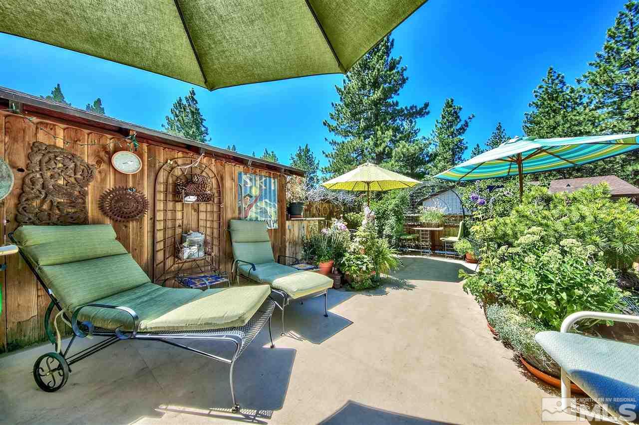 450 Mcfaul Way Zephyr Cove, NV 89448 - Photo 16 of 20 a view of a chair and table in backyard
