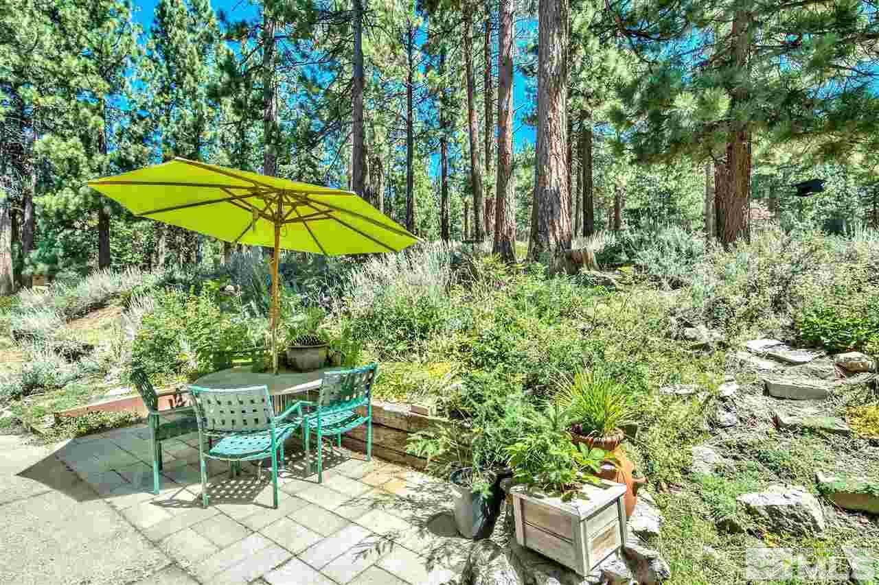 450 Mcfaul Way Zephyr Cove, NV 89448 - Photo 3 of 20 an outdoor space with furniture and umbrella