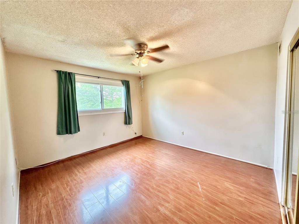 912 Lake Destiny Road, Unit F Altamonte Springs, FL 32714 - Photo 4 of 12 an empty room with windows and fan