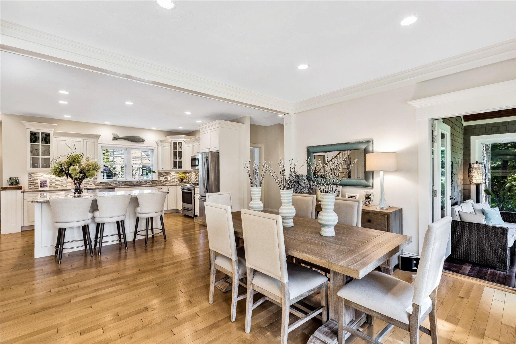 74 The Heights Mashpee, MA 02649 - Photo 11 of 34 a view of a dining room with furniture wooden floor and a rug