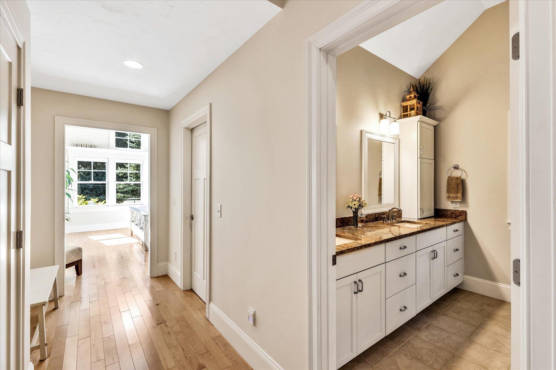 74 The Heights Mashpee, MA 02649 - Photo 18 of 34 a bathroom with a double vanity sink and mirror