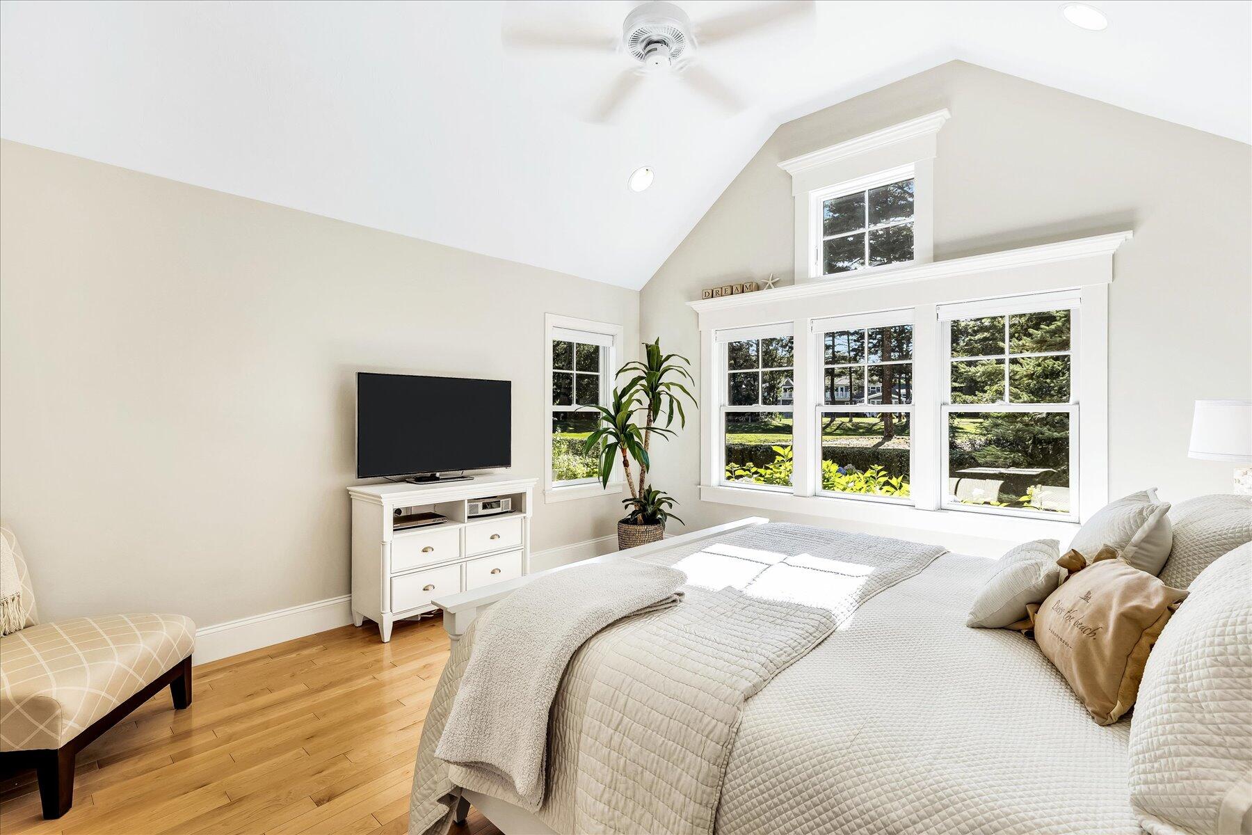 74 The Heights Mashpee, MA 02649 - Photo 20 of 34 a bedroom with a bed and a flat screen tv