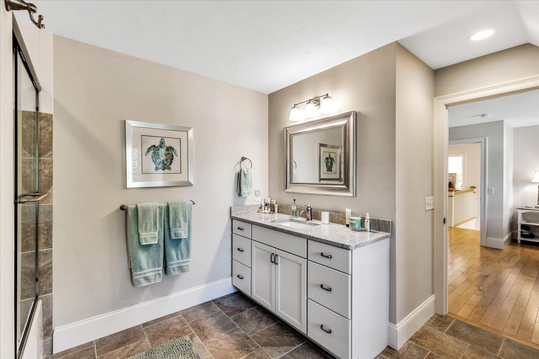 74 The Heights Mashpee, MA 02649 - Photo 26 of 34 a bathroom with a double vanity sink and a mirror