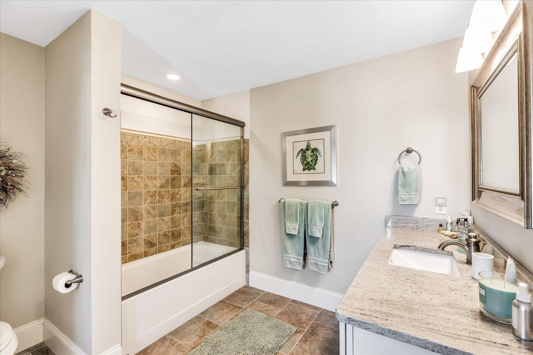 74 The Heights Mashpee, MA 02649 - Photo 27 of 34 a bathroom with a granite countertop sink a mirror and shower