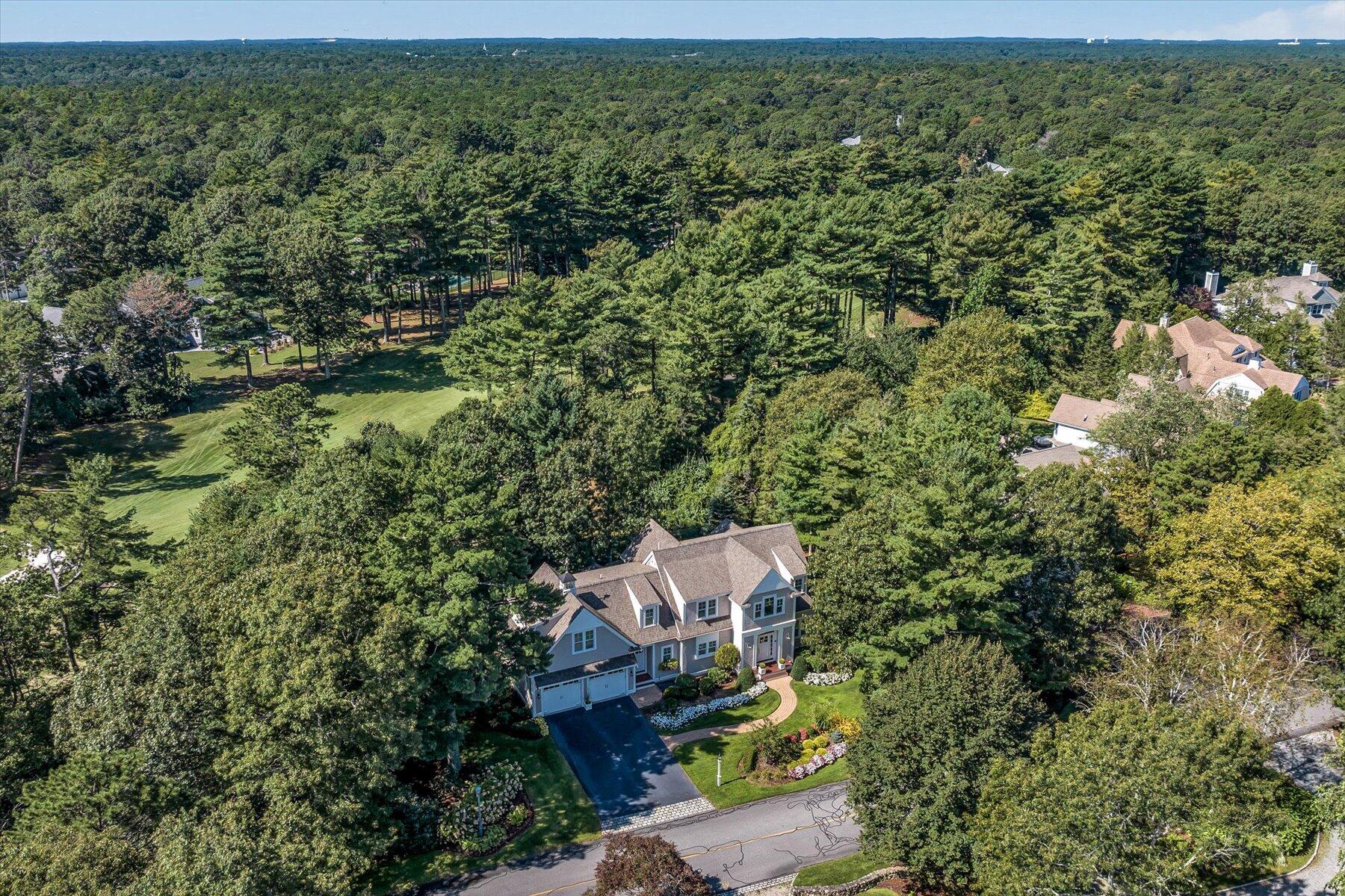 74 The Heights Mashpee, MA 02649 - Photo 32 of 34 an aerial view of a house with a yard