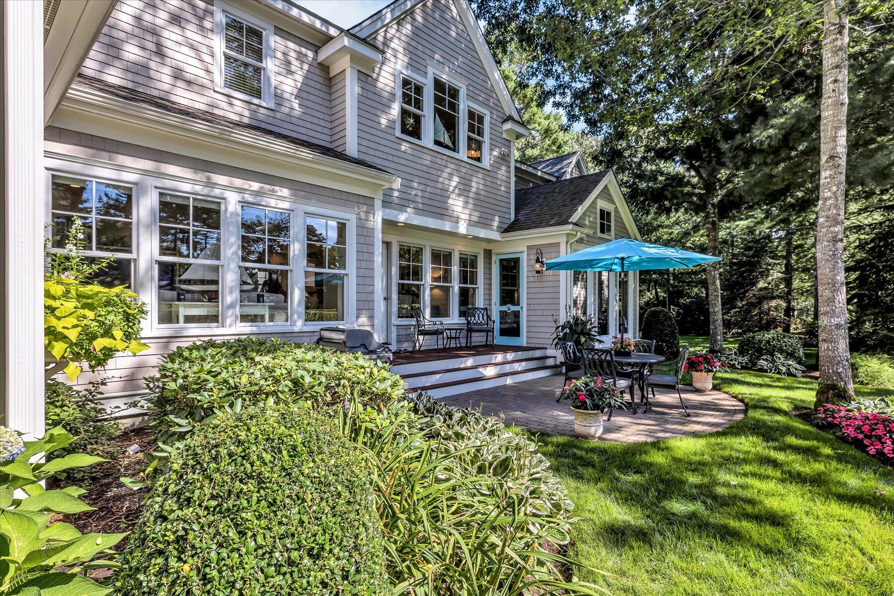 74 The Heights Mashpee, MA 02649 - Photo 4 of 34 a view of a house with a porch and sitting area