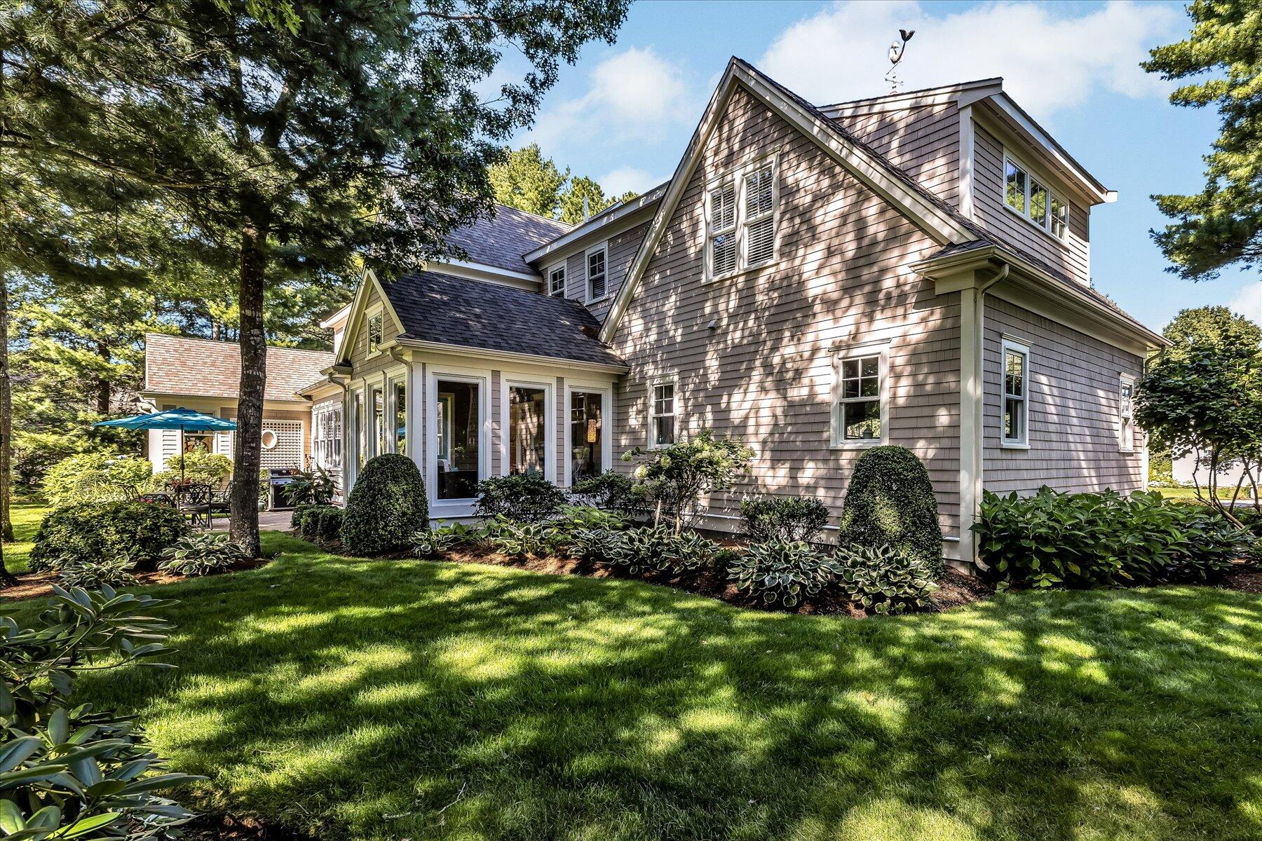 74 The Heights Mashpee, MA 02649 - Photo 5 of 34 a view of a house with a yard and plants