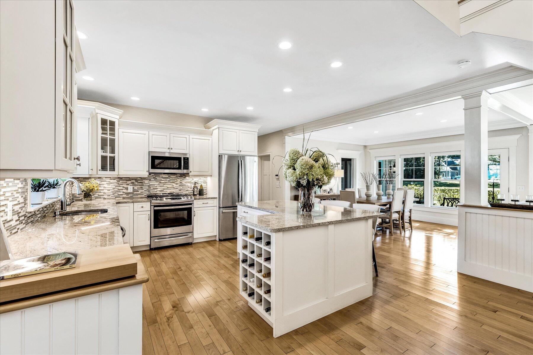 74 The Heights Mashpee, MA 02649 - Photo 8 of 34 a kitchen with white cabinets and appliances