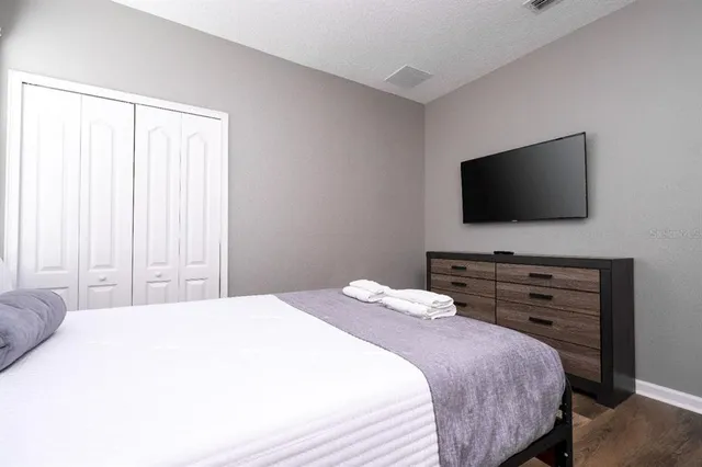 a spacious bathroom with a granite countertop sink a toilet and shower