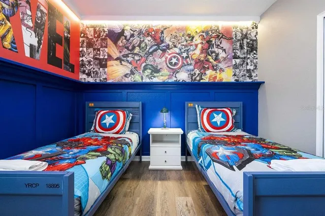 a bathroom with a sink a toilet a mirror and shower