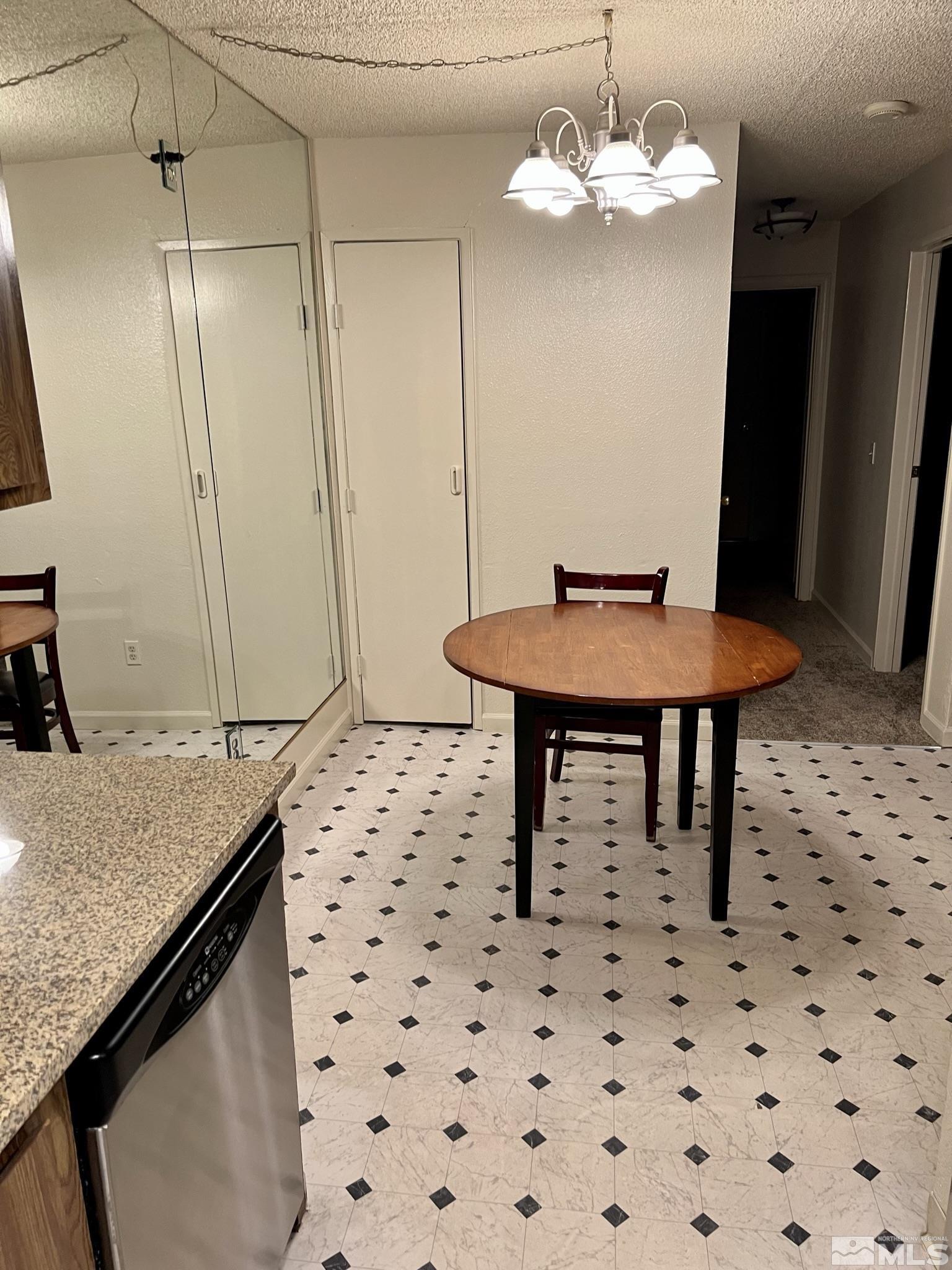 2090 Highview Court, Unit 1 Reno, NV 89512 - Photo 6 of 18 a view of a kitchen with a sink and chandelier