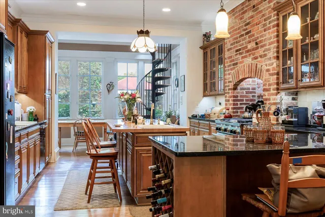 a view of a patio with table and chairs under an umbrella