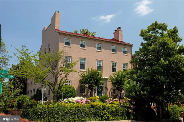 a view of a house with a yard and garden