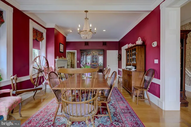 a kitchen with stainless steel appliances kitchen island granite countertop a refrigerator stove and sink