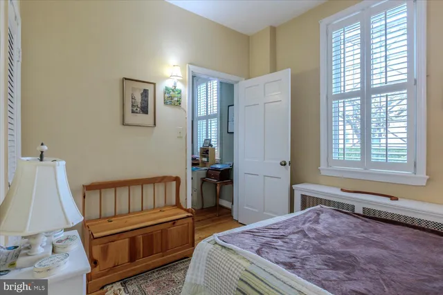 a living room with furniture and large windows