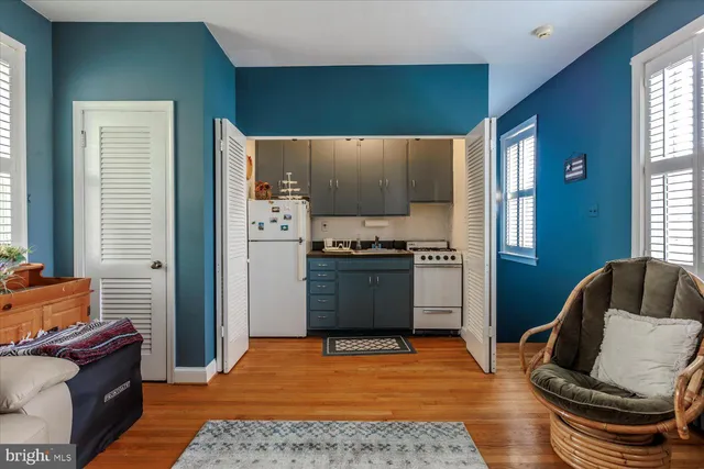 a bed room with furniture and a wooden floor
