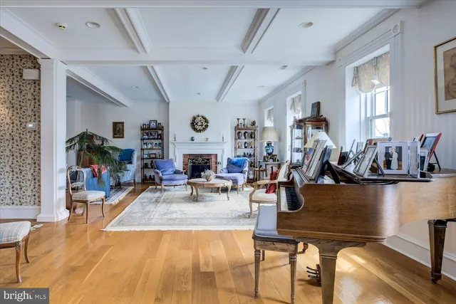 a living room with furniture fireplace and window