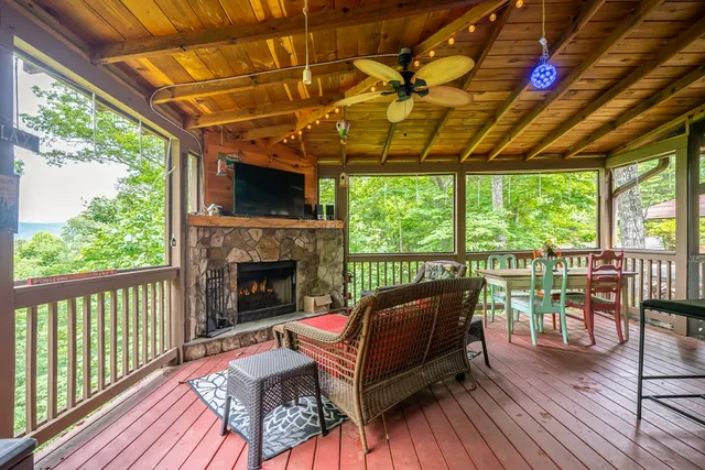 a outdoor living space with furniture and a fireplace
