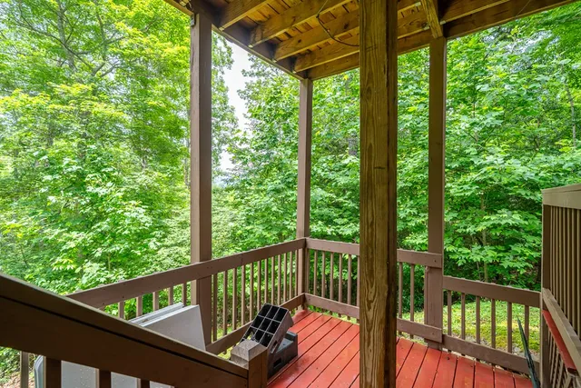 a view of porch with wooden floor