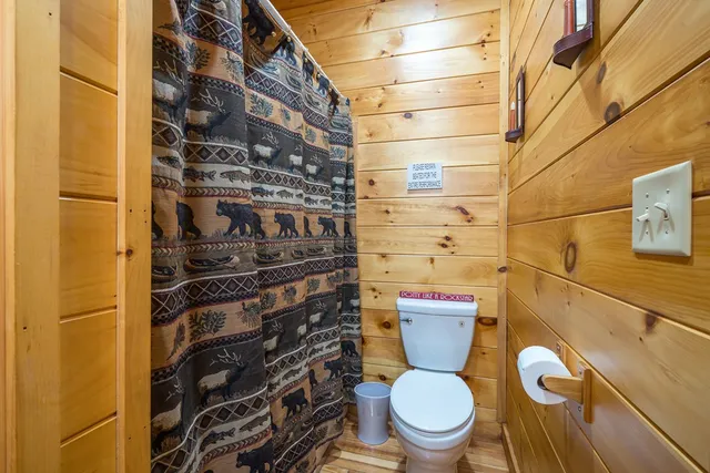 a bedroom with a bed and a desk