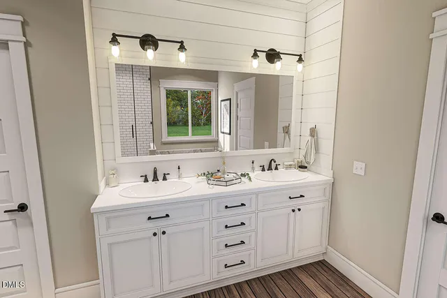 a kitchen with white cabinets and sink