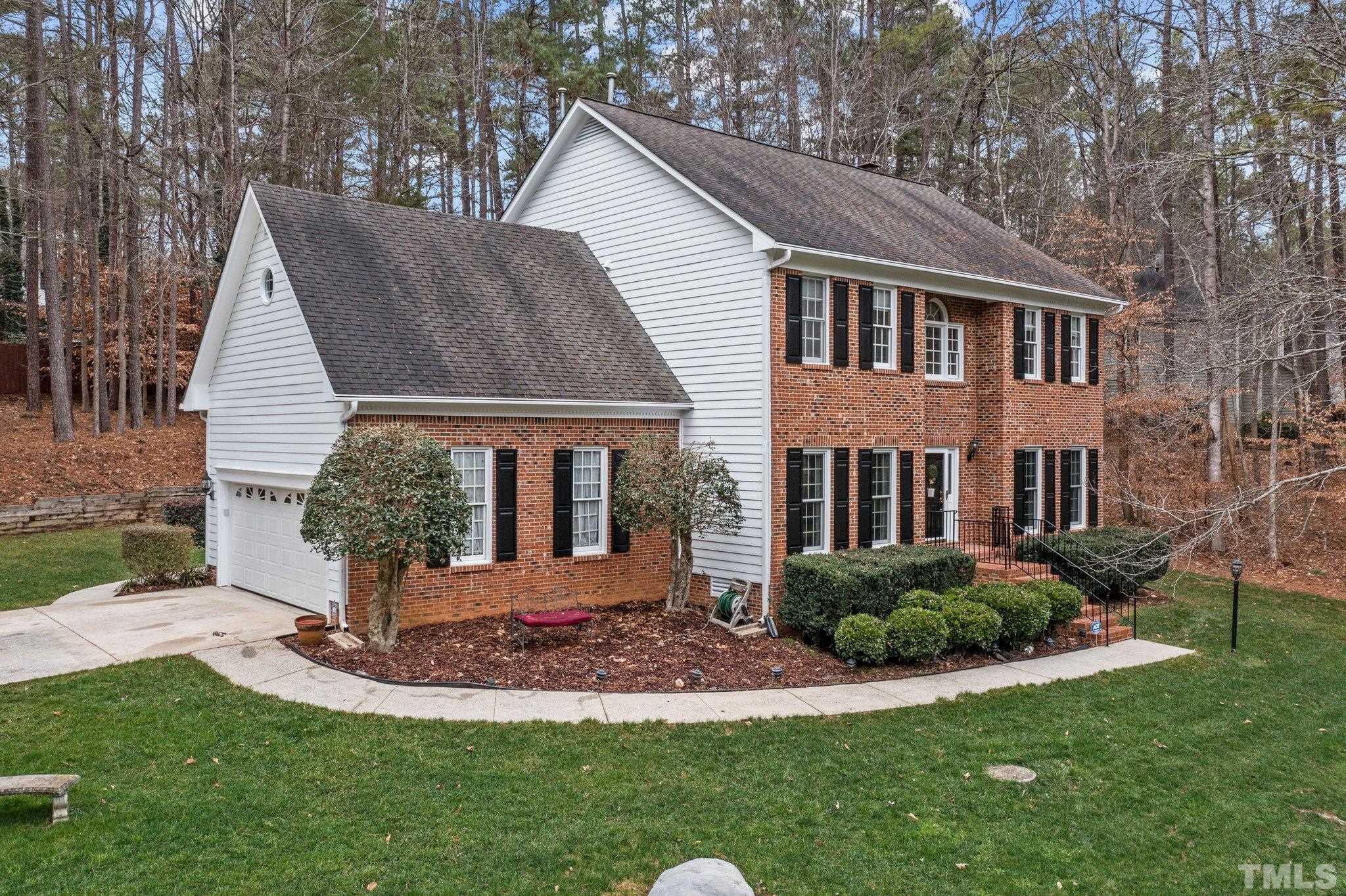6201 Trevor Court Raleigh, NC 27613 - Photo 3 of 19 a front view of a house with a yard