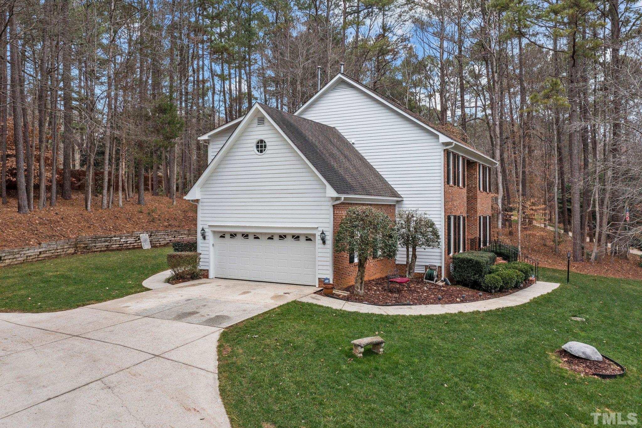 6201 Trevor Court Raleigh, NC 27613 - Photo 8 of 19 a view of a house with backyard and garden