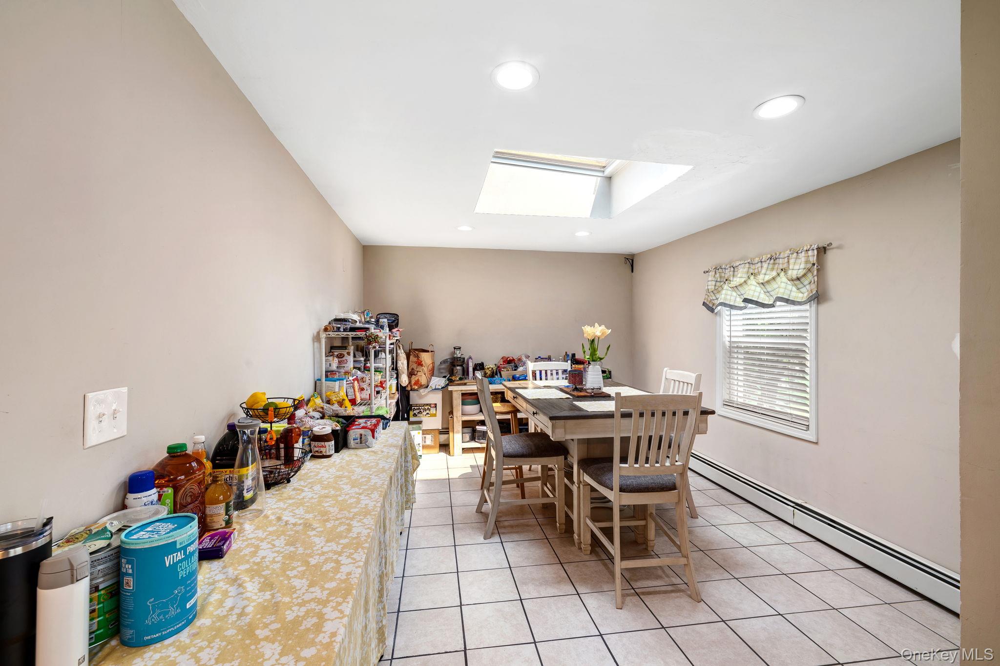 6 Farmstead Road New Windsor, NY 12553 - Photo 15 of 32 Dining room featuring a skylight, a baseboard heating unit, light tile patterned floors, and recessed lighting