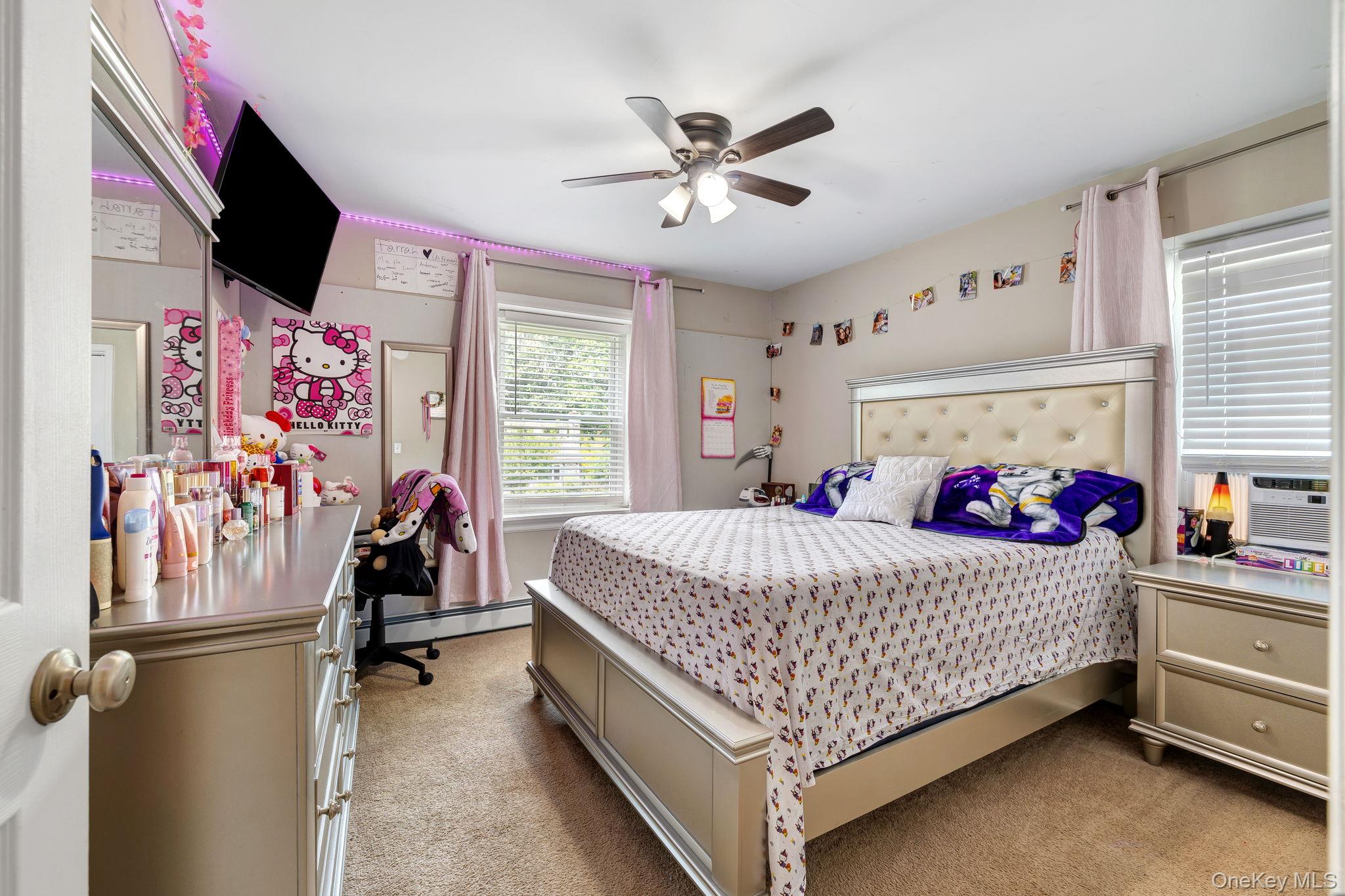6 Farmstead Road New Windsor, NY 12553 - Photo 20 of 32 Bedroom featuring light carpet, a baseboard radiator, ceiling fan, and cooling unit