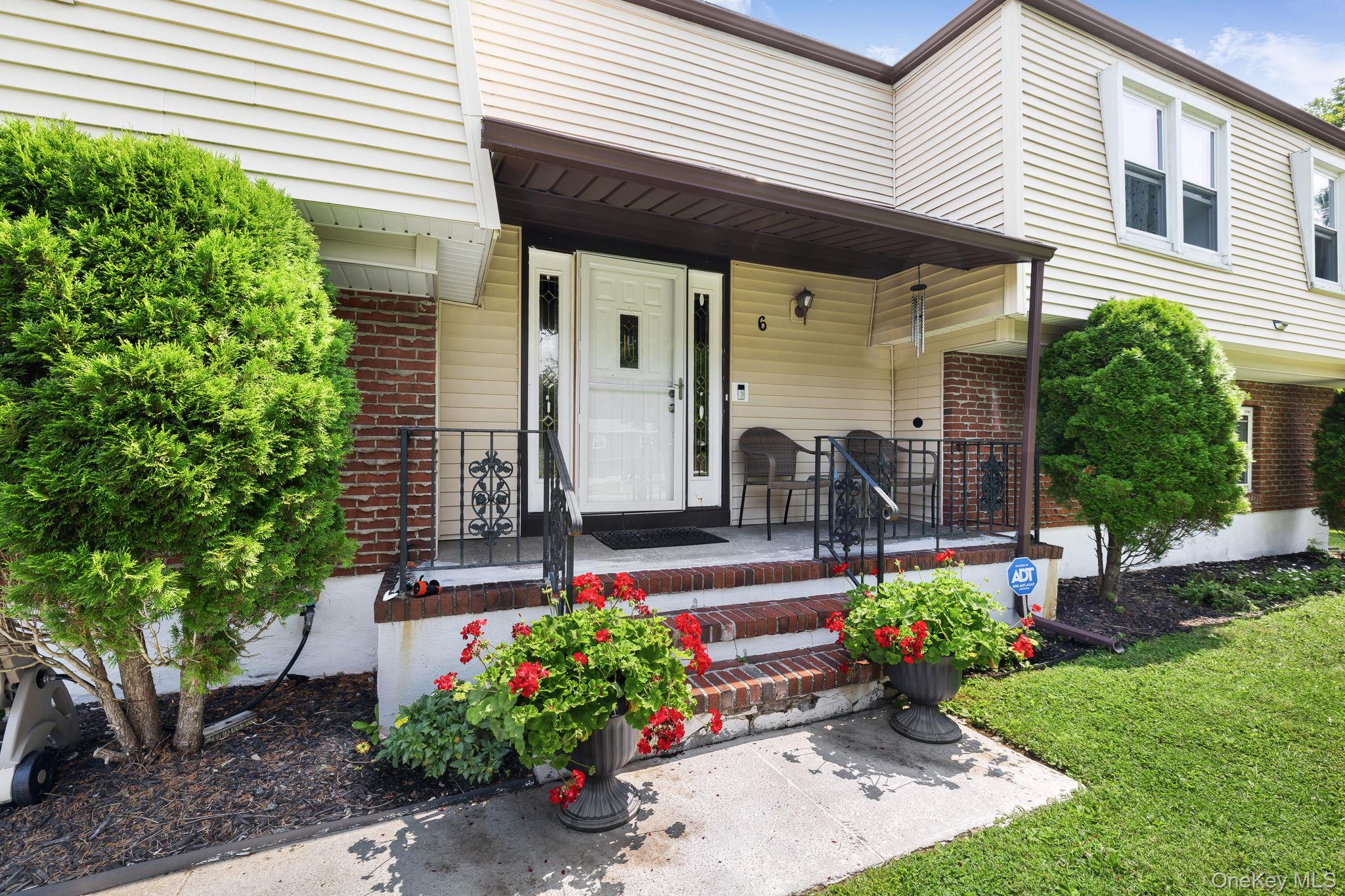 6 Farmstead Road New Windsor, NY 12553 - Photo 2 of 32 View of exterior entry featuring brick siding and a porch