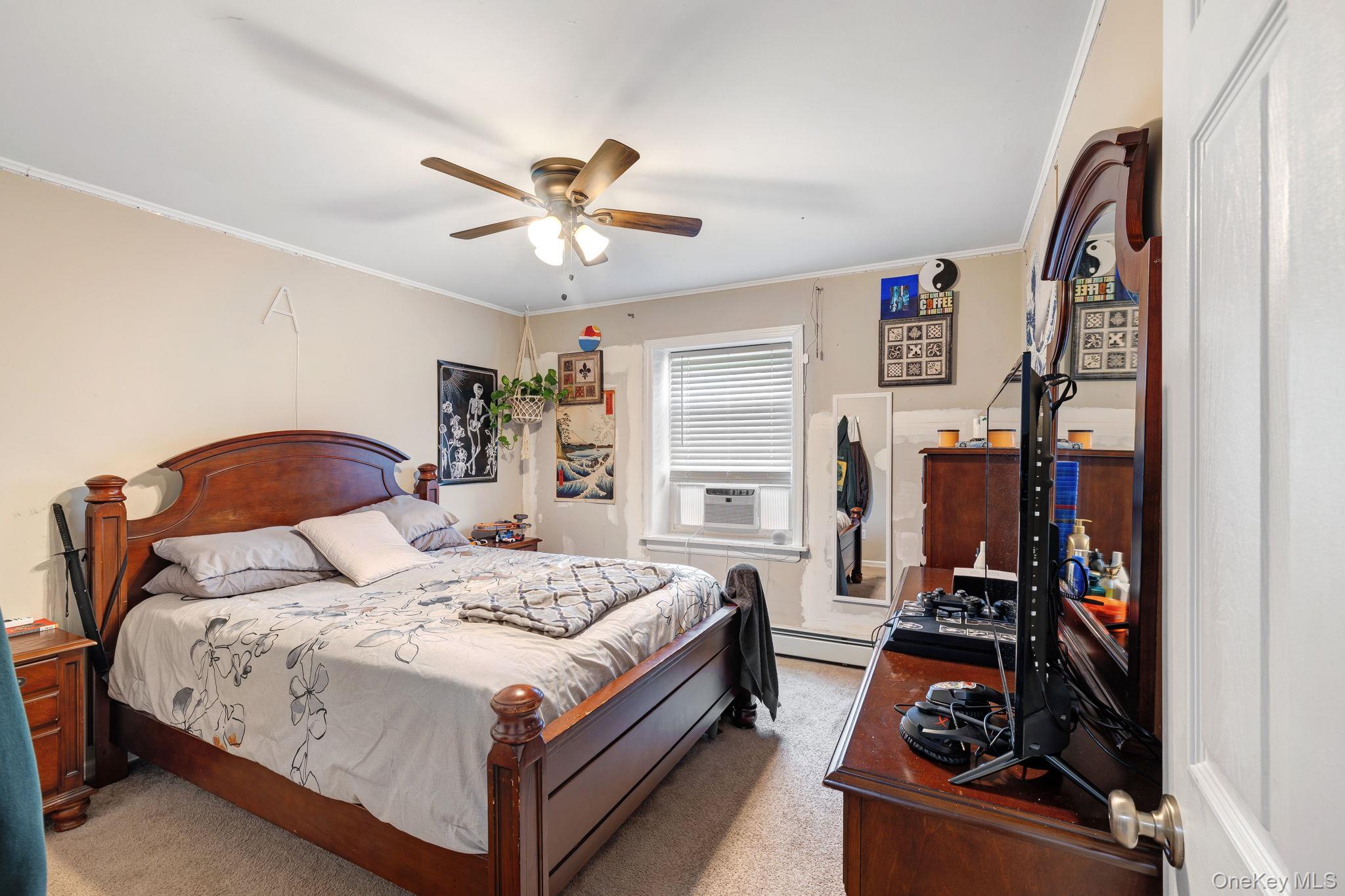 6 Farmstead Road New Windsor, NY 12553 - Photo 23 of 32 Bedroom with carpet flooring, crown molding, ceiling fan, a baseboard heating unit, and cooling unit