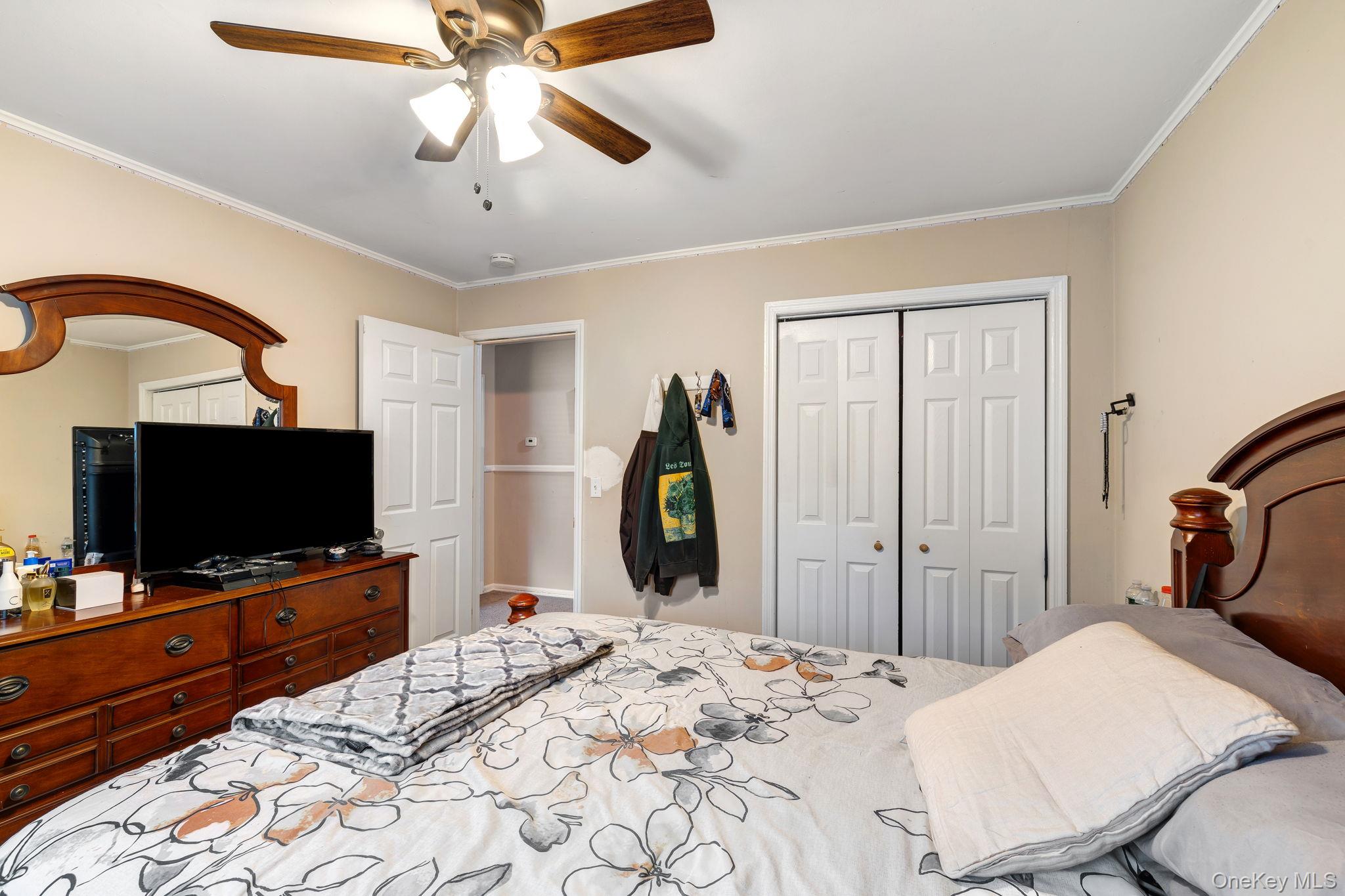 6 Farmstead Road New Windsor, NY 12553 - Photo 24 of 32 Bedroom featuring ornamental molding, a ceiling fan, and a closet