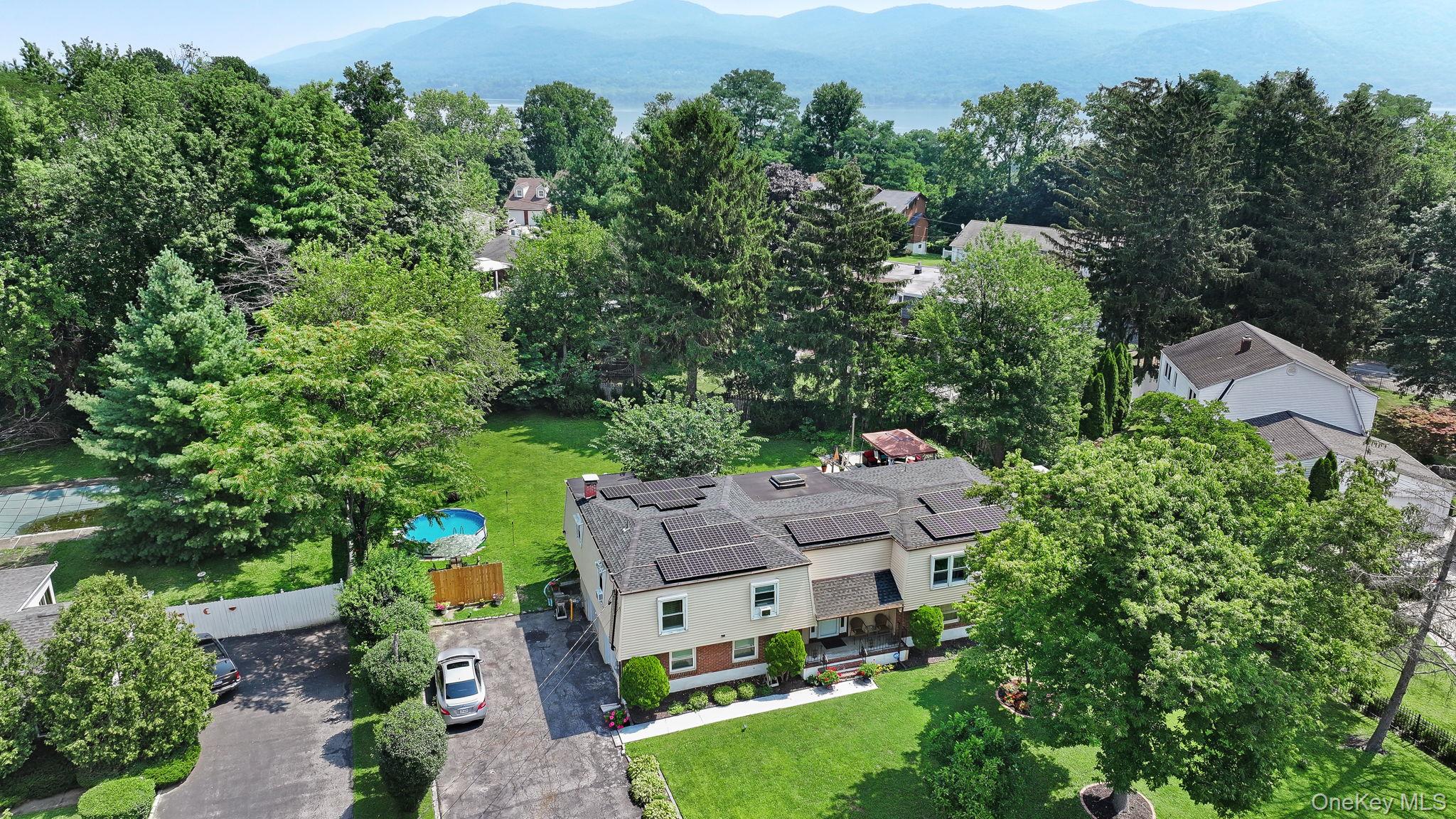 6 Farmstead Road New Windsor, NY 12553 - Photo 31 of 32 Aerial view of property and surrounding area featuring a mountainous background and a pool area