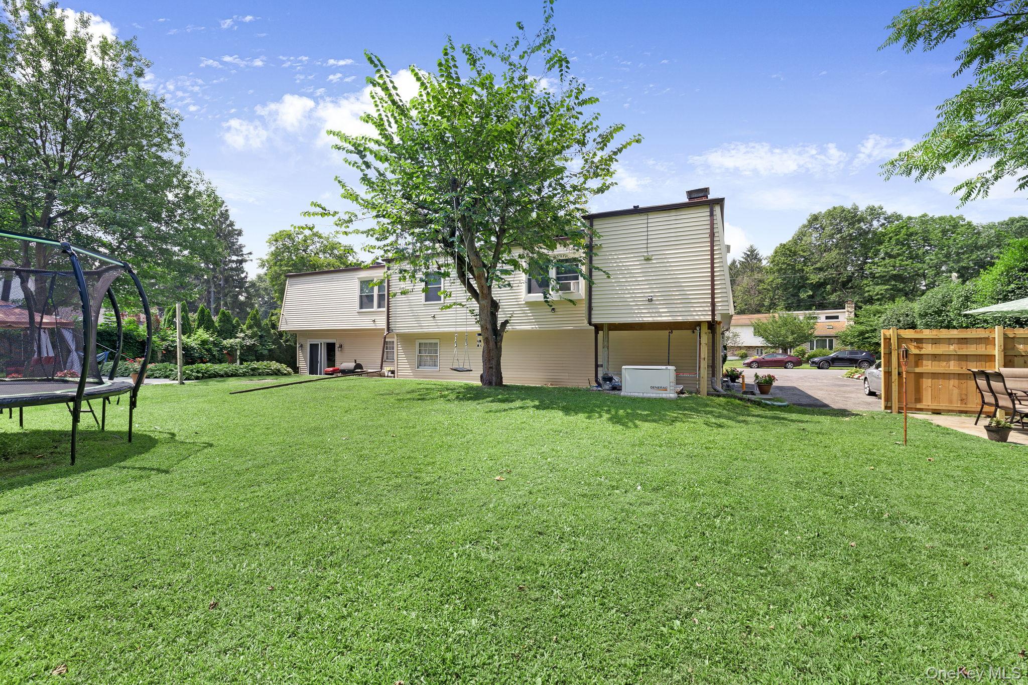6 Farmstead Road New Windsor, NY 12553 - Photo 32 of 32 View of yard with a trampoline and a patio area